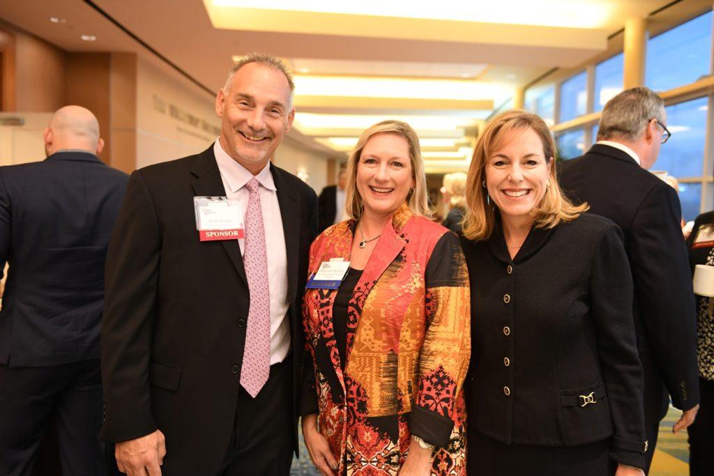 Bret Strong (left) of The Strong Firm, along with Shannon Wilson with The Cynthia Woods Mitchell Pavillion, and Debra Sukin (right) with Houston Methodist The Woodlands pose for a picture at The Woodlands Power Breakfast held on October 7 at The Woodlands Waterway Marriott Hotel & Convention Center. Photo credit: Daniel Ortoz at The Houston Business Journal.